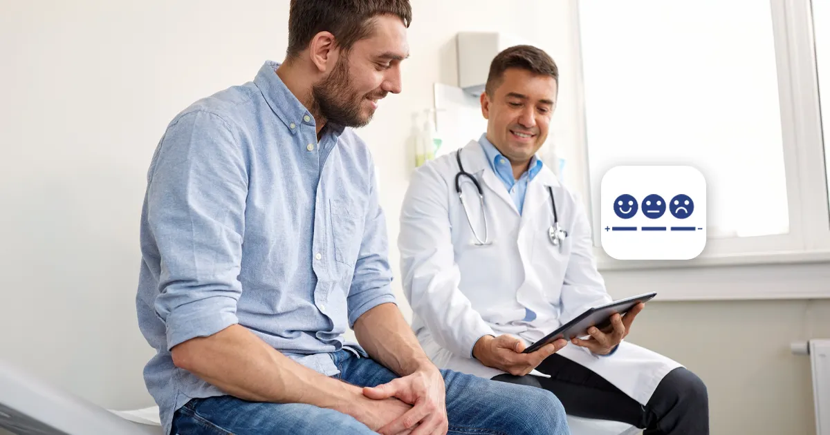 Doctor showing patient how to record pain scores on Personix platform