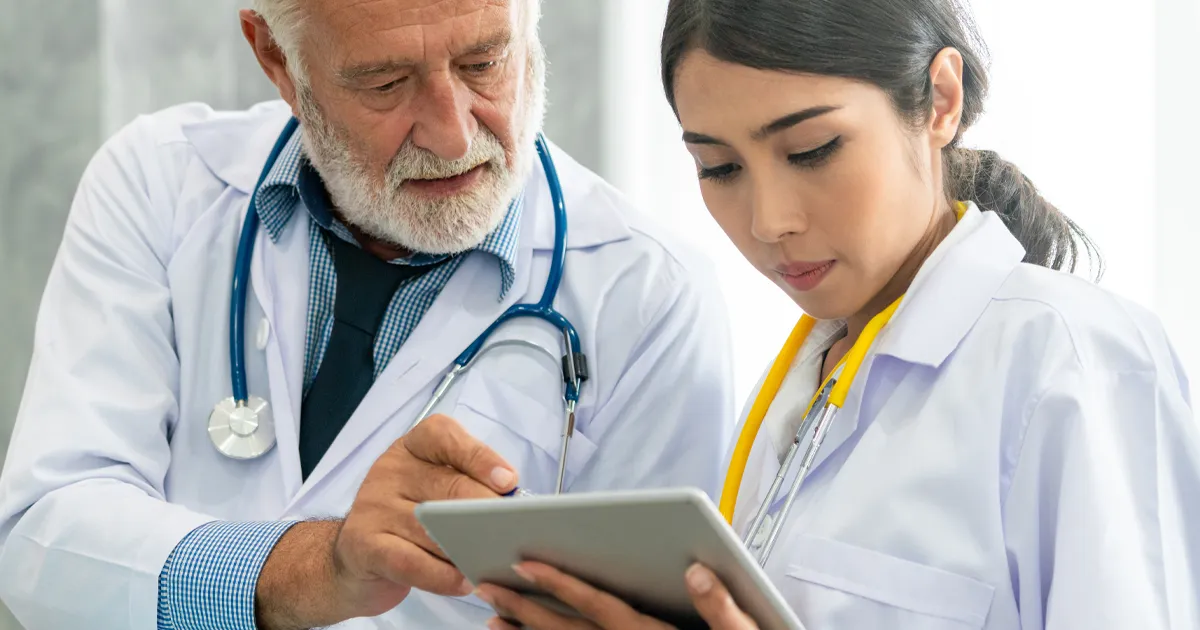 healthcare professionals using reviewing patient survey results 2